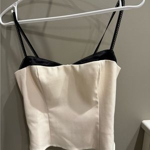 New with tags, never worn. Beautiful top, but doesn’t fit me properly.